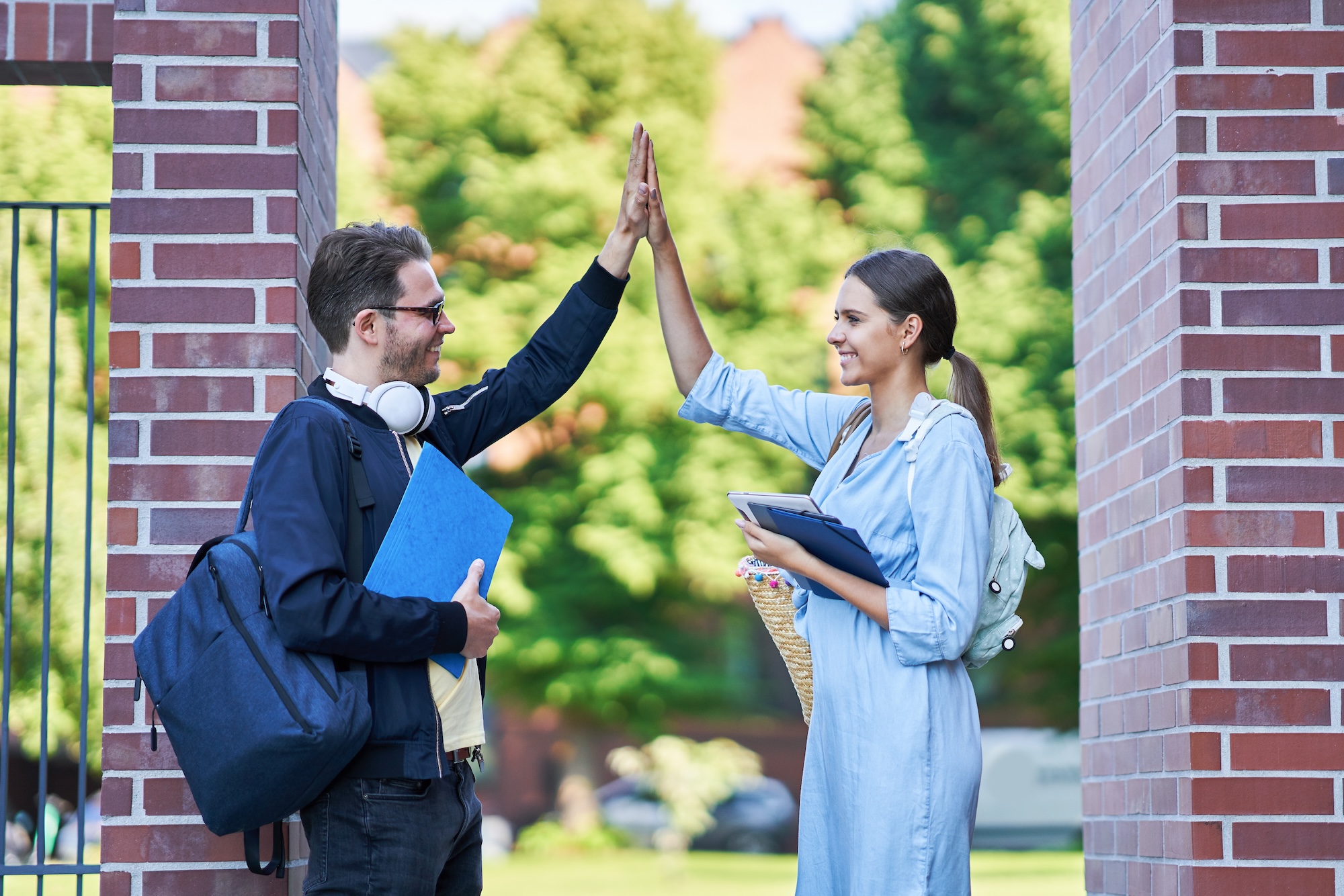 A man and a woman giving each other a high five